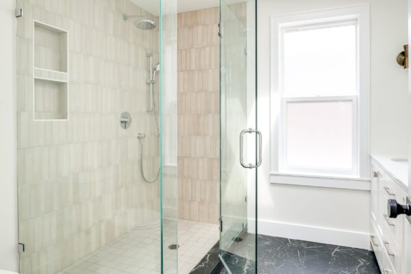 Luxurious,Walk-in,Shower,In,Bathroom,With,Modern,Brass,Sconces,And